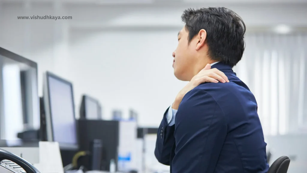 Physiotherapist guiding office worker in seated spinal twist stretch